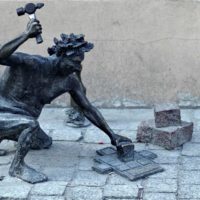 cutting pavers with hammer and chisel